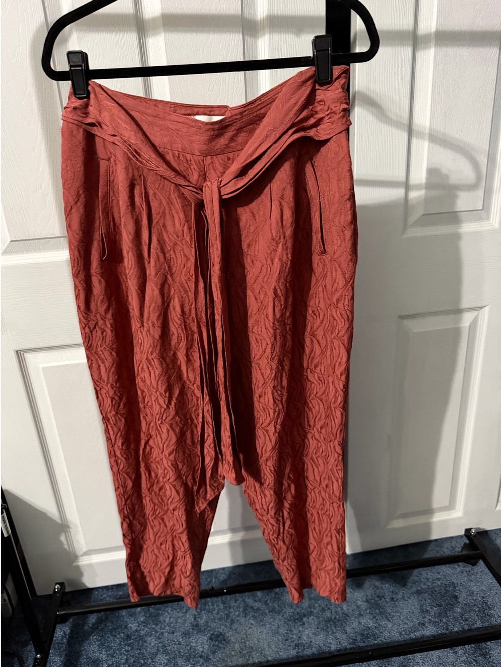 Anthropologie Maeve Textured Rust Tie-Waist pants.